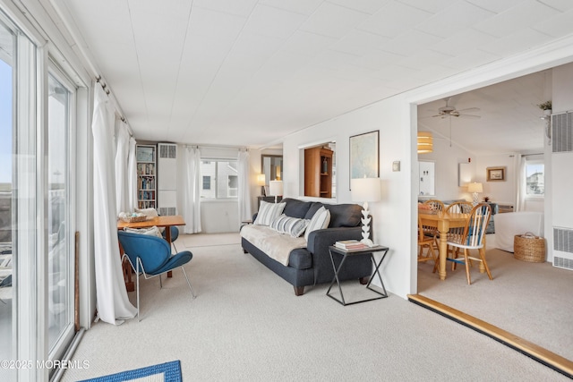 398 Kingfisher Rd, Tuckerton, NJ 08087 - living area with carpet, a heating unit, and a ceiling fan