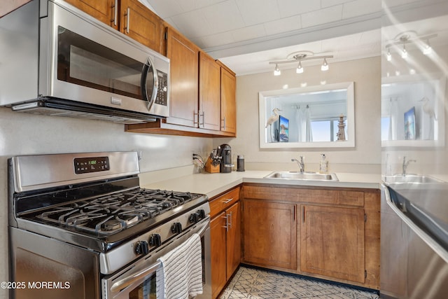 398 Kingfisher Rd, Tuckerton, NJ 08087 - kitchen featuring appliances with stainless steel finishes, brown cabinetry, and light countertops