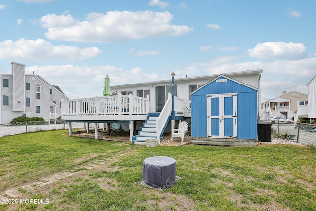 398 Kingfisher Rd, Tuckerton, NJ 08087 - back of property featuring a storage unit, a deck, a fenced backyard, and stairs