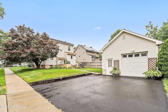 124 Mckinnon St, Piscataway Twp, NJ 08854 - view of side of property with a garage and asphalt driveway