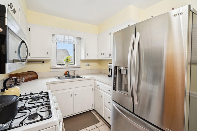 124 Mckinnon St, Piscataway Twp, NJ 08854 - kitchen with stainless steel appliances, white cabinetry, light countertops, and light tile patterned floors