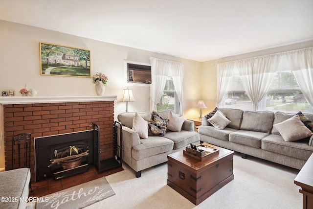 124 Mckinnon St, Piscataway Twp, NJ 08854 - living area with a wall mounted air conditioner and a brick fireplace