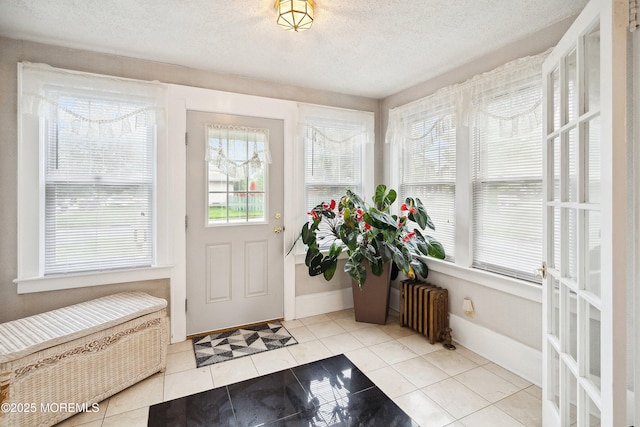 124 Mckinnon St, Piscataway Twp, NJ 08854 - tiled foyer entrance featuring radiator heating unit and a textured ceiling