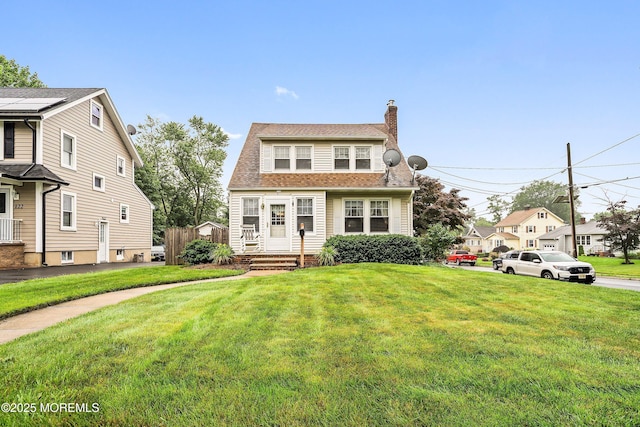 124 Mckinnon St, Piscataway Twp, NJ 08854 - view of front of property with a chimney and a front yard