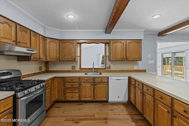 367 Marine St, Tuckerton, NJ 08087 - kitchen with stainless steel gas range, white dishwasher, under cabinet range hood, beamed ceiling, and brown cabinetry