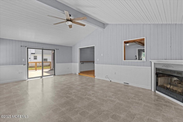 367 Marine St, Tuckerton, NJ 08087 - unfurnished living room featuring ceiling fan, a fireplace, tile patterned floors, and wooden walls
