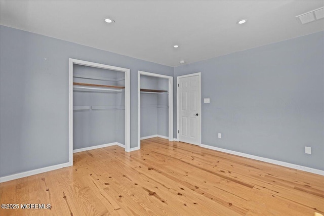 367 Marine St, Tuckerton, NJ 08087 - unfurnished bedroom with multiple closets, wood finished floors, and recessed lighting