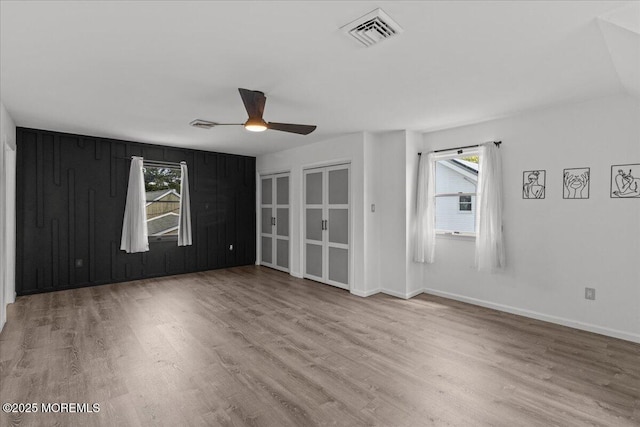 367 Marine St, Tuckerton, NJ 08087 - empty room with wood finished floors, ceiling fan, and plenty of natural light