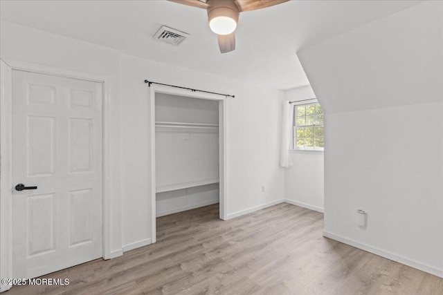 367 Marine St, Tuckerton, NJ 08087 - unfurnished bedroom with wood finished floors, a closet, and a ceiling fan