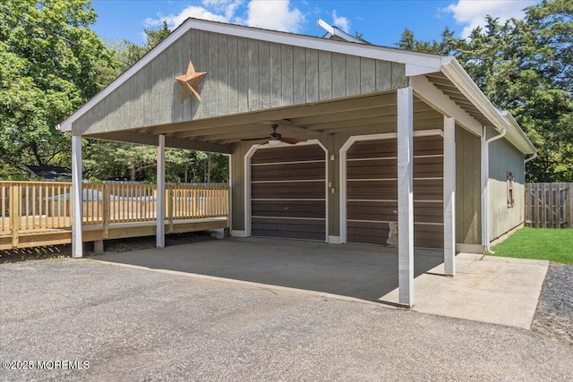 367 Marine St, Tuckerton, NJ 08087 - garage featuring a carport and asphalt driveway