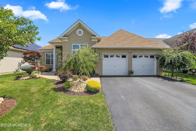 130 Masters Dr, Monroe, NJ 08831 - view of front facade featuring stucco siding, an attached garage, asphalt driveway, a front yard, and a shingled roof