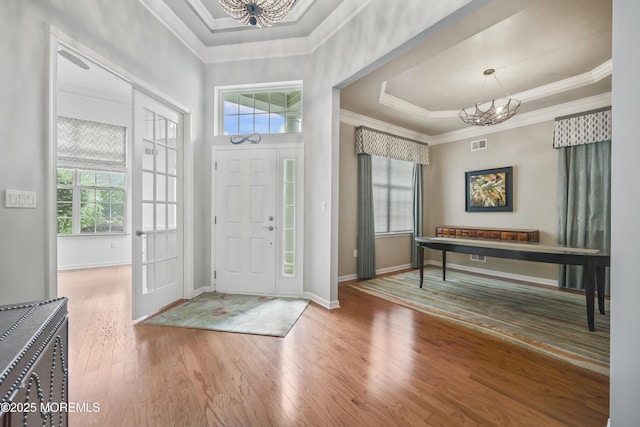 130 Masters Dr, Monroe, NJ 08831 - foyer entrance featuring a chandelier, hardwood / wood-style flooring, crown molding, and a tray ceiling