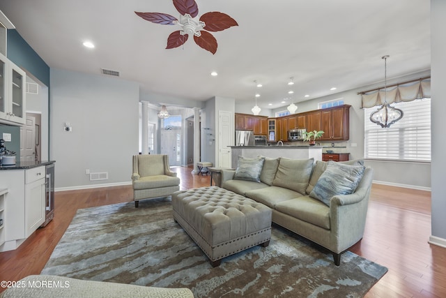 130 Masters Dr, Monroe, NJ 08831 - living area featuring a ceiling fan, wine cooler, recessed lighting, a chandelier, and wood finished floors