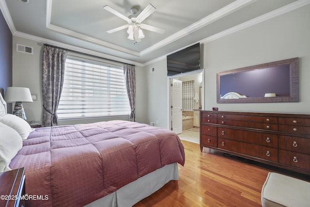 130 Masters Dr, Monroe, NJ 08831 - bedroom featuring light wood-style flooring, ornamental molding, a raised ceiling, ensuite bath, and a ceiling fan
