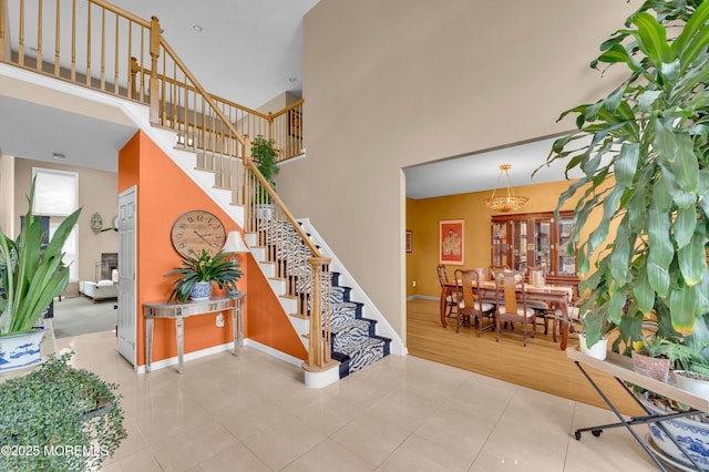 47 Lori St, Monroe, NJ 08831 - stairs featuring a towering ceiling and tile patterned flooring
