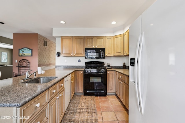 404 5th Ave, Spring Lake, NJ 07762 - kitchen featuring black appliances, a peninsula, stone countertops, recessed lighting, and light tile patterned floors