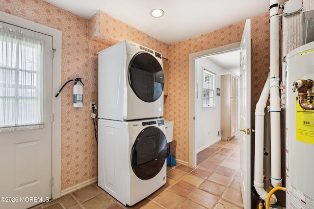 404 5th Ave, Spring Lake, NJ 07762 - laundry room with stacked washing machine and dryer, gas water heater, plenty of natural light, and wallpapered walls