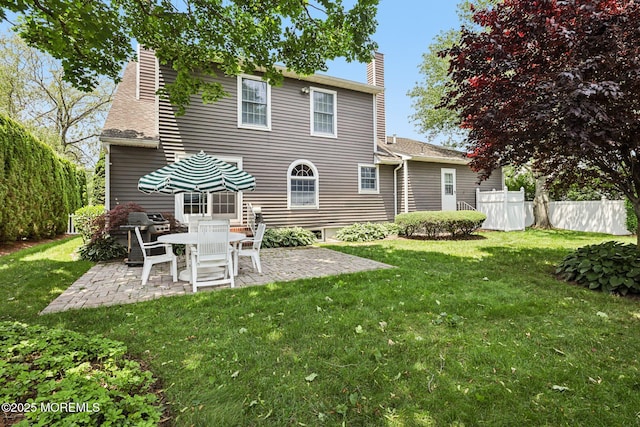 404 5th Ave, Spring Lake, NJ 07762 - back of property with a chimney, a patio area, and a shingled roof
