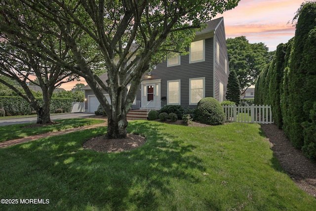 404 5th Ave, Spring Lake, NJ 07762 - colonial house featuring an attached garage and concrete driveway