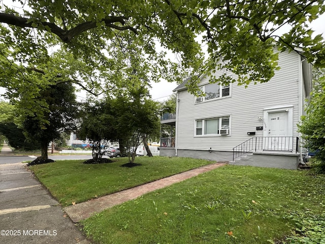 1029 1st Ave, Asbury Park, NJ 07712 - view of front of home featuring a front lawn and cooling unit