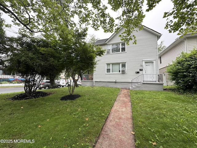 1029 1st Ave, Asbury Park, NJ 07712 - rear view of house with a lawn
