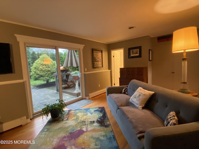 3 Maria Ct, Brick, NJ 08724 - living room with baseboard heating, light wood finished floors, and ornamental molding