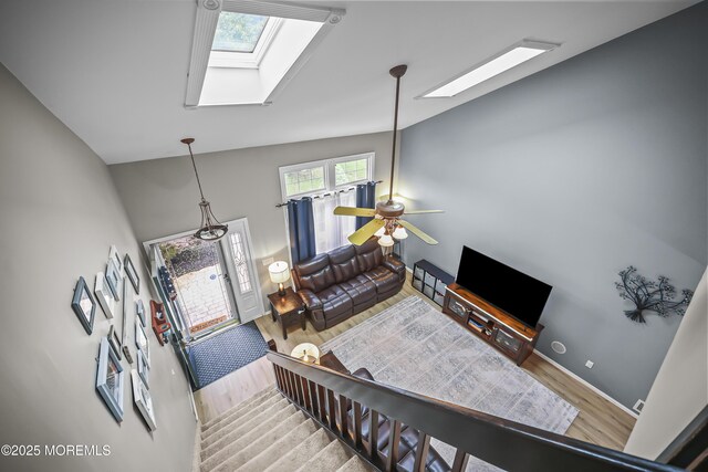 39 Sweet Gum Rd, Howell, NJ 07731 - living area featuring a skylight, wood finished floors, ceiling fan, and vaulted ceiling