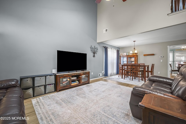 39 Sweet Gum Rd, Howell, NJ 07731 - living area with ceiling fan, wood finished floors, a towering ceiling, and a chandelier