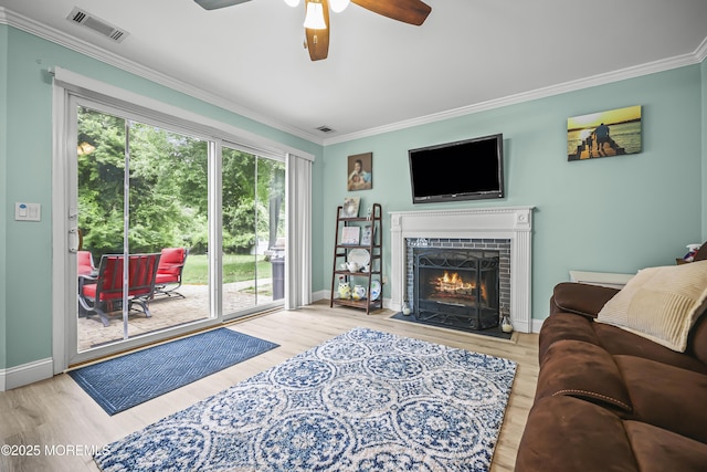 39 Sweet Gum Rd, Howell, NJ 07731 - living room with ornamental molding, a ceiling fan, wood finished floors, and a fireplace