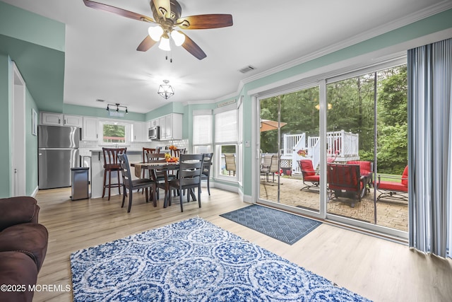 39 Sweet Gum Rd, Howell, NJ 07731 - living room with light wood-style floors, ceiling fan, and ornamental molding