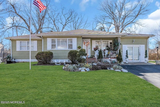 426 Shady Ln, Howell, NJ 07731 - view of front of house featuring covered porch, a front yard, and a shingled roof