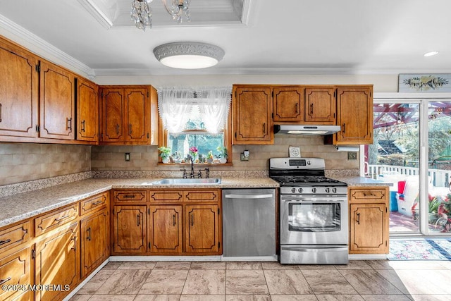 426 Shady Ln, Howell, NJ 07731 - kitchen featuring stainless steel appliances, under cabinet range hood, brown cabinets, crown molding, and recessed lighting