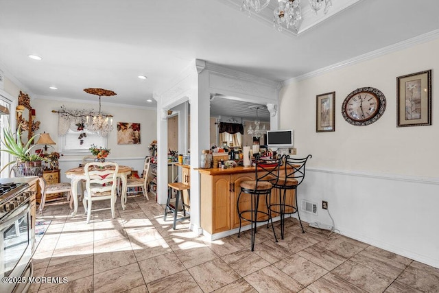 426 Shady Ln, Howell, NJ 07731 - kitchen with a chandelier, gas range, crown molding, and recessed lighting
