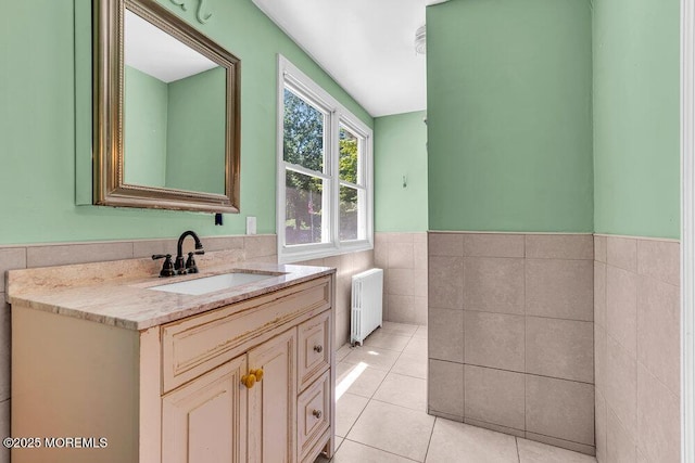 276 Chandler Rd, Jackson, NJ 08527 - bathroom featuring radiator heating unit, vanity, tile walls, a wainscoted wall, and tile patterned floors