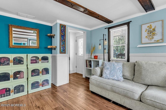 276 Chandler Rd, Jackson, NJ 08527 - living area with a wainscoted wall, wood finished floors, beam ceiling, and ornamental molding