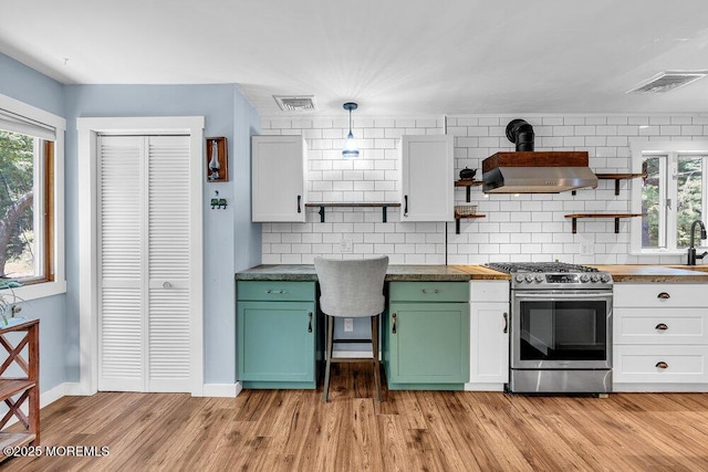 276 Chandler Rd, Jackson, NJ 08527 - kitchen featuring stainless steel range with gas cooktop, open shelves, green cabinets, butcher block countertops, and exhaust hood