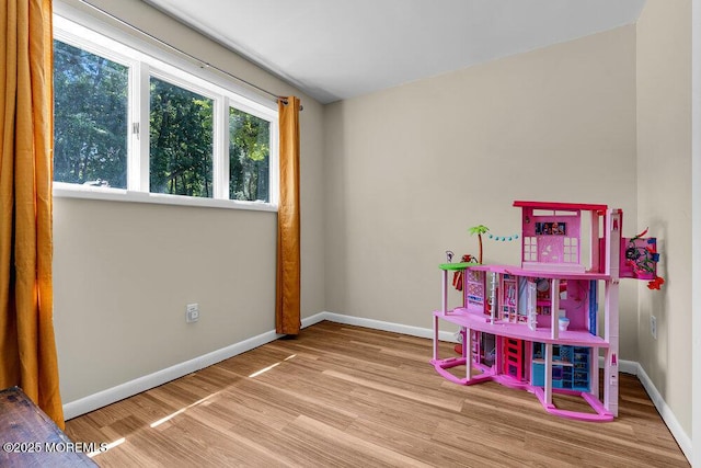 276 Chandler Rd, Jackson, NJ 08527 - playroom with wood finished floors and baseboards