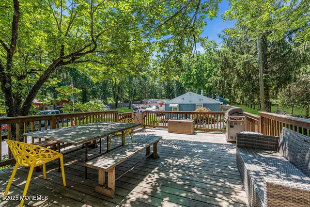 276 Chandler Rd, Jackson, NJ 08527 - wooden terrace featuring an outdoor structure, outdoor dining space, and view of scattered trees