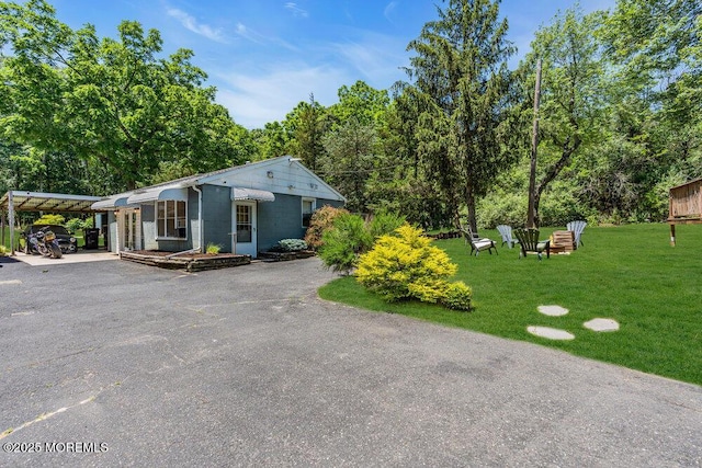 276 Chandler Rd, Jackson, NJ 08527 - view of front of property with a front yard, concrete block siding, and driveway