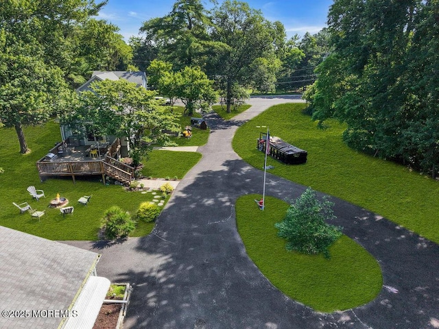 276 Chandler Rd, Jackson, NJ 08527 - view of home's community with a wooden deck, a lawn, view of wooded area, and an outdoor fire pit