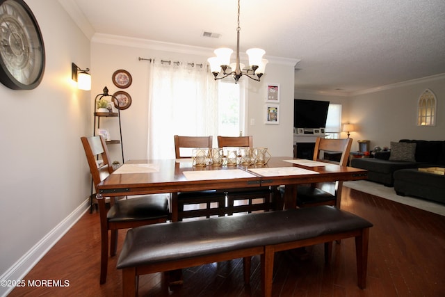 20 Atlantis Ter, Freehold, NJ 07728 - dining area with a chandelier, ornamental molding, and wood finished floors