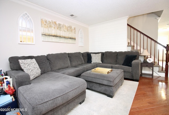 20 Atlantis Ter, Freehold, NJ 07728 - living area with crown molding, stairs, and wood finished floors