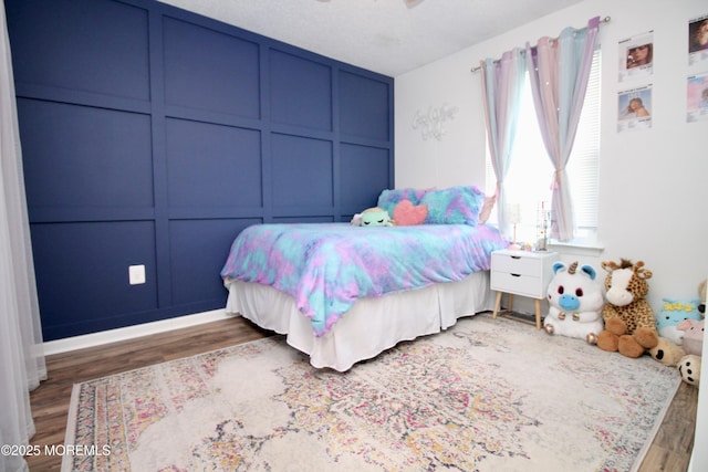20 Atlantis Ter, Freehold, NJ 07728 - bedroom featuring wood finished floors, a decorative wall, and a ceiling fan