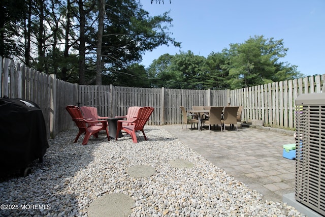 20 Atlantis Ter, Freehold, NJ 07728 - fenced backyard featuring outdoor dining area, a grill, a patio area, and an outdoor fire pit