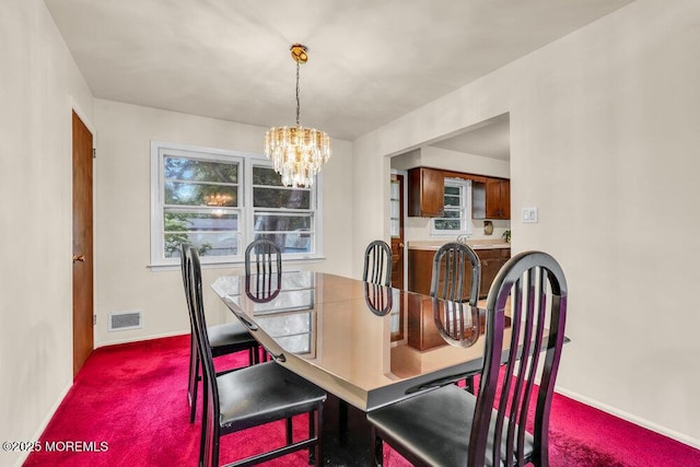 458 Drum Point Rd, Brick, NJ 08723 - carpeted dining room featuring a chandelier and baseboards