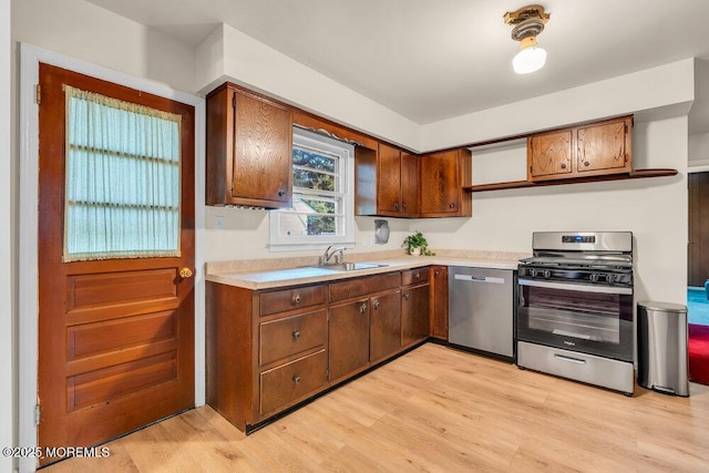 458 Drum Point Rd, Brick, NJ 08723 - kitchen featuring stainless steel appliances, light wood-style floors, light countertops, and brown cabinets
