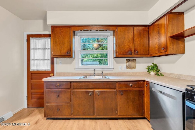 458 Drum Point Rd, Brick, NJ 08723 - kitchen featuring dishwasher, light wood-style floors, light countertops, and brown cabinets