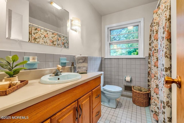 458 Drum Point Rd, Brick, NJ 08723 - bathroom with tile patterned flooring, tile walls, vanity, curtained shower, and wainscoting