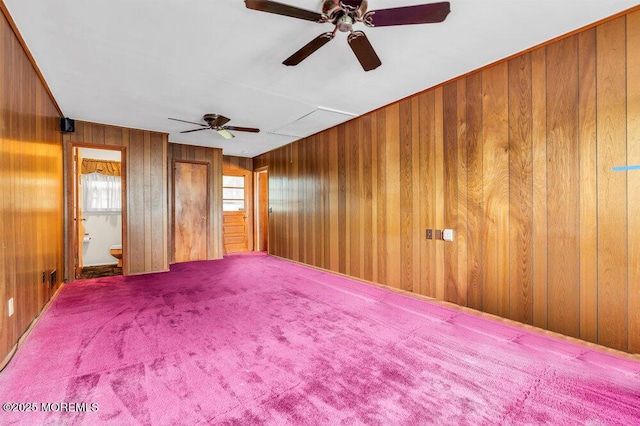458 Drum Point Rd, Brick, NJ 08723 - unfurnished room featuring a ceiling fan, wood walls, and carpet