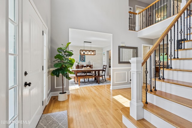 43 Sweet Gum Rd, Howell, NJ 07731 - entryway with a towering ceiling, hardwood / wood-style floors, stairs, and a wainscoted wall